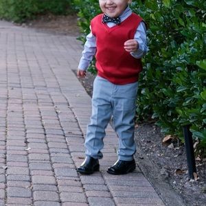 Red vest with button down shirt and bow tie